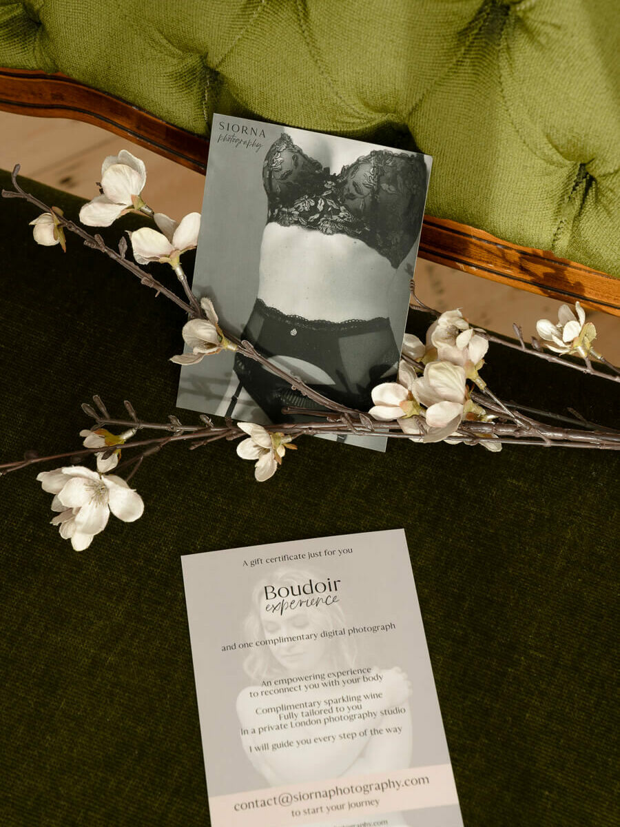 a boudoir gift card on a green couch with flowers