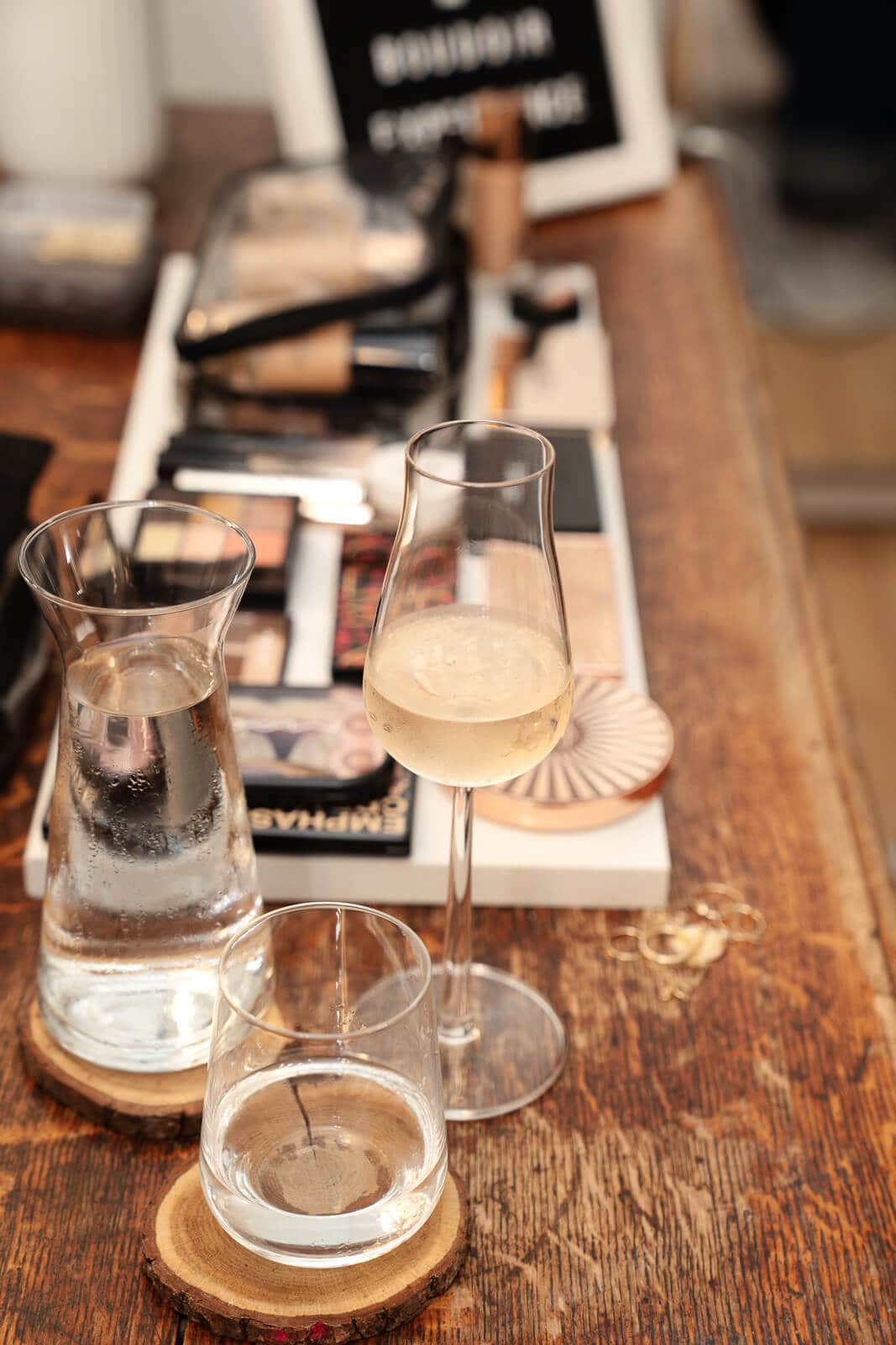 Sparkling wine and accessories set out in the studio, part of the Valentine’s boudoir photography gift experience.