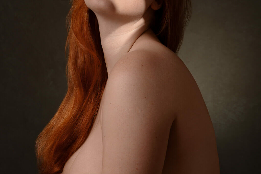 unique valentine's gift of a red haired woman draped in silk on a london boudoir photography photoshoot