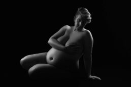 a pregnant woman, nude on a london maternity photoshoot