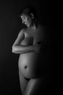 a pregnant woman, nude on a london maternity photoshoot
