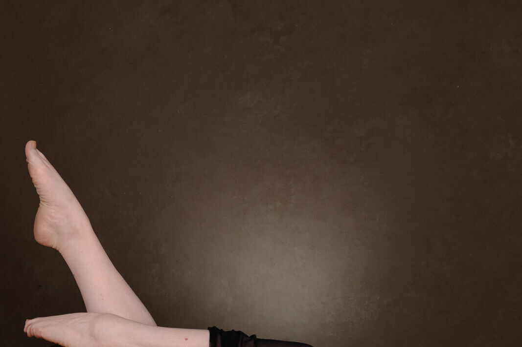 A pair of legs demonstrating how to prepare for a photoshoot boudoir style.