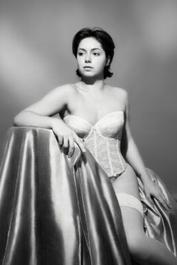 A woman in her bridal underwear with an old hollywood vibe for a bridal boudoir photography photoshoot