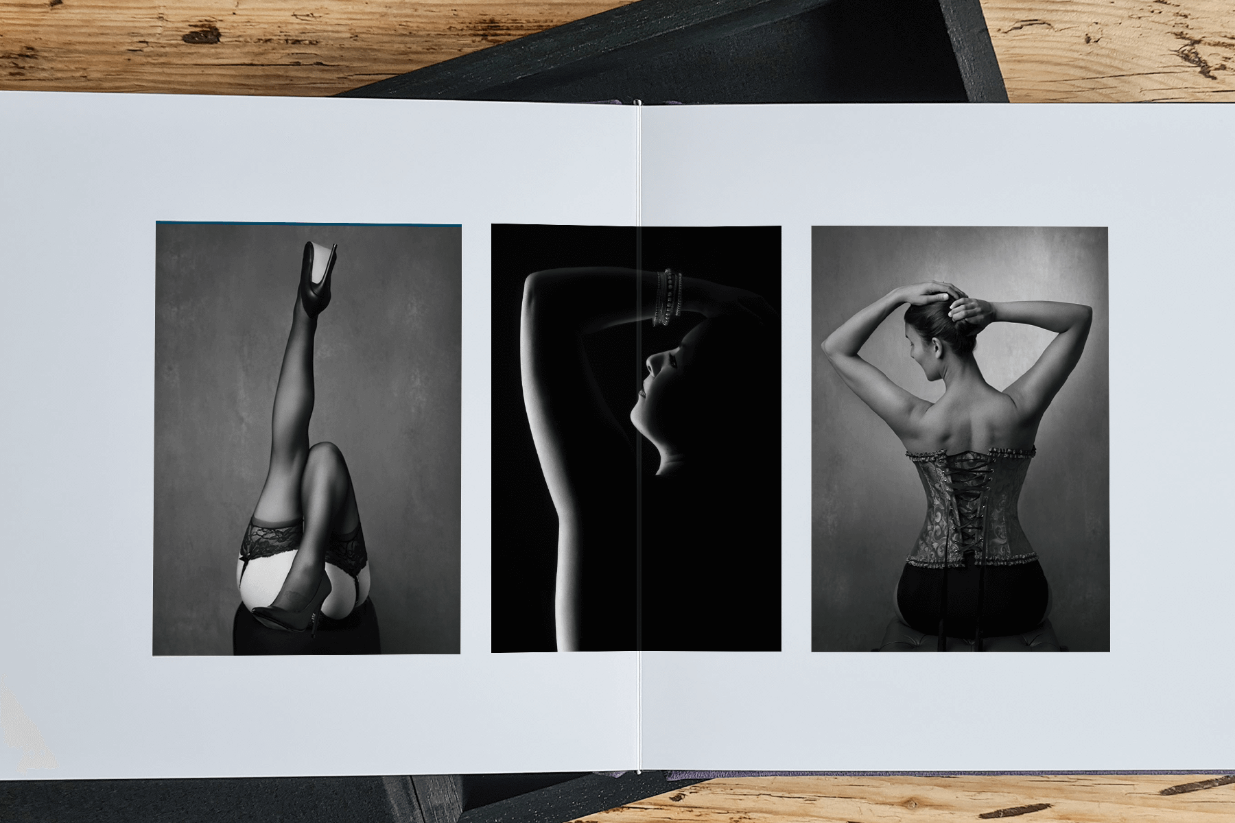 a boudoir album showing a mock up of three boudoir images from legs, back and a body silhouette.