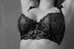 a double d bra captured in black and white on a boudoir photography uk photoshoot