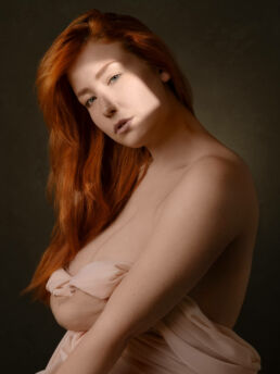intimate photographs of curvy woman with red hair on a london boudoir photoshoot