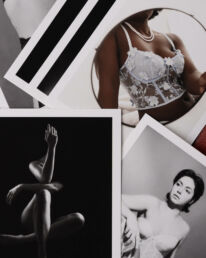 boudoir pictures scatterd on the floor as postcards