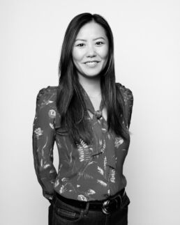 An Asian woman in a floral shirt in black and white from a London Headshot Photographer