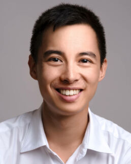 An asian man in a white shirt taken by a london headshot photographer