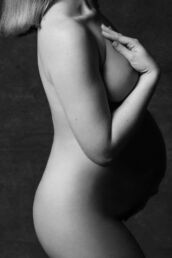 a london maternity photoshoot of a tasteful nude in black and white