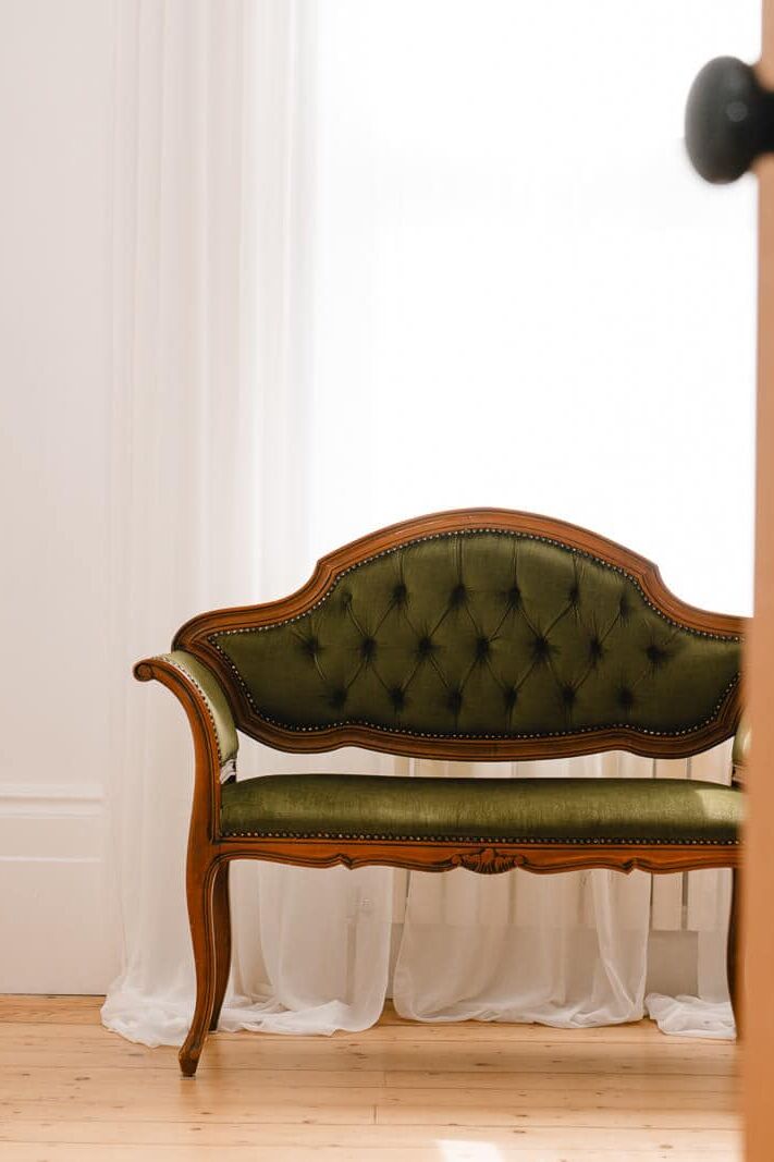 Elegant wooden floors and natural light with vintage chairs and wooden door opening inside my London boudoir studio.
