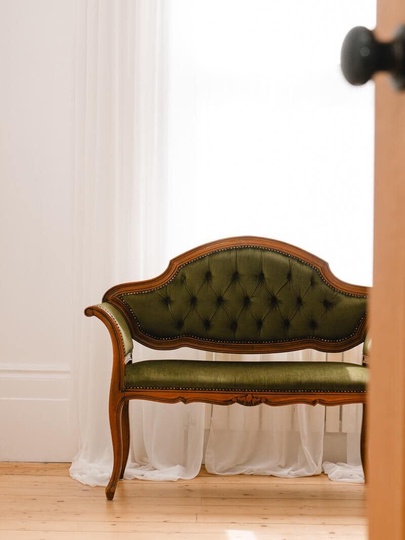 Elegant wooden floors and natural light with vintage chairs and wooden door opening inside my London boudoir studio.