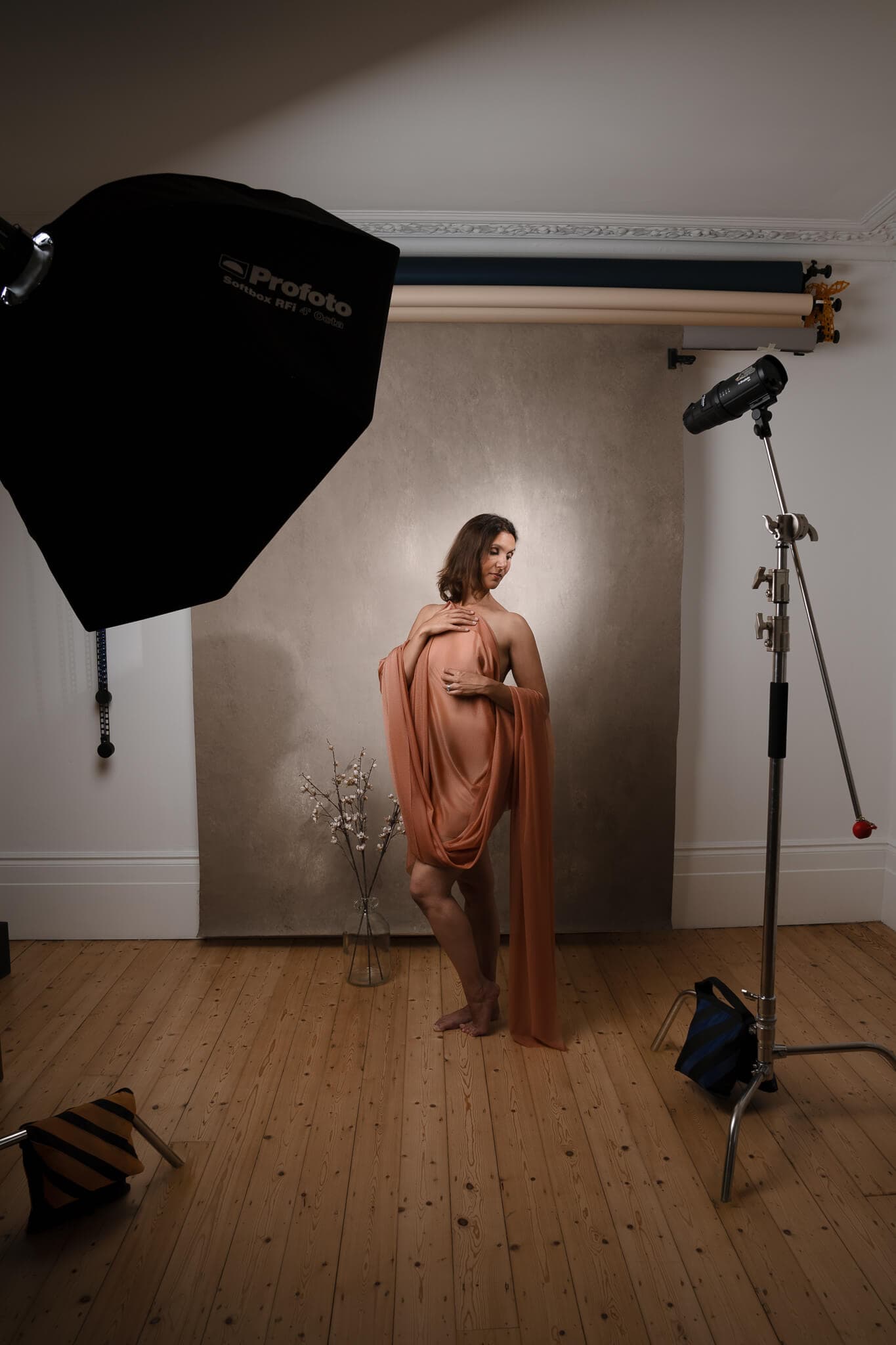 Boudoir photography lighting setup in a London studio with softbox, backdrop and guided posing.