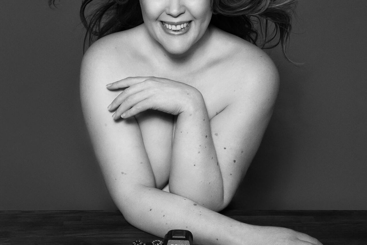 a female boudoir photographer with camera in london