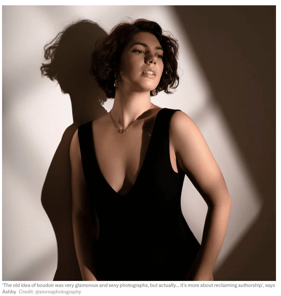 Behind-the-scenes photograph showing lighting and posing guidance during an ethical boudoir photography session.