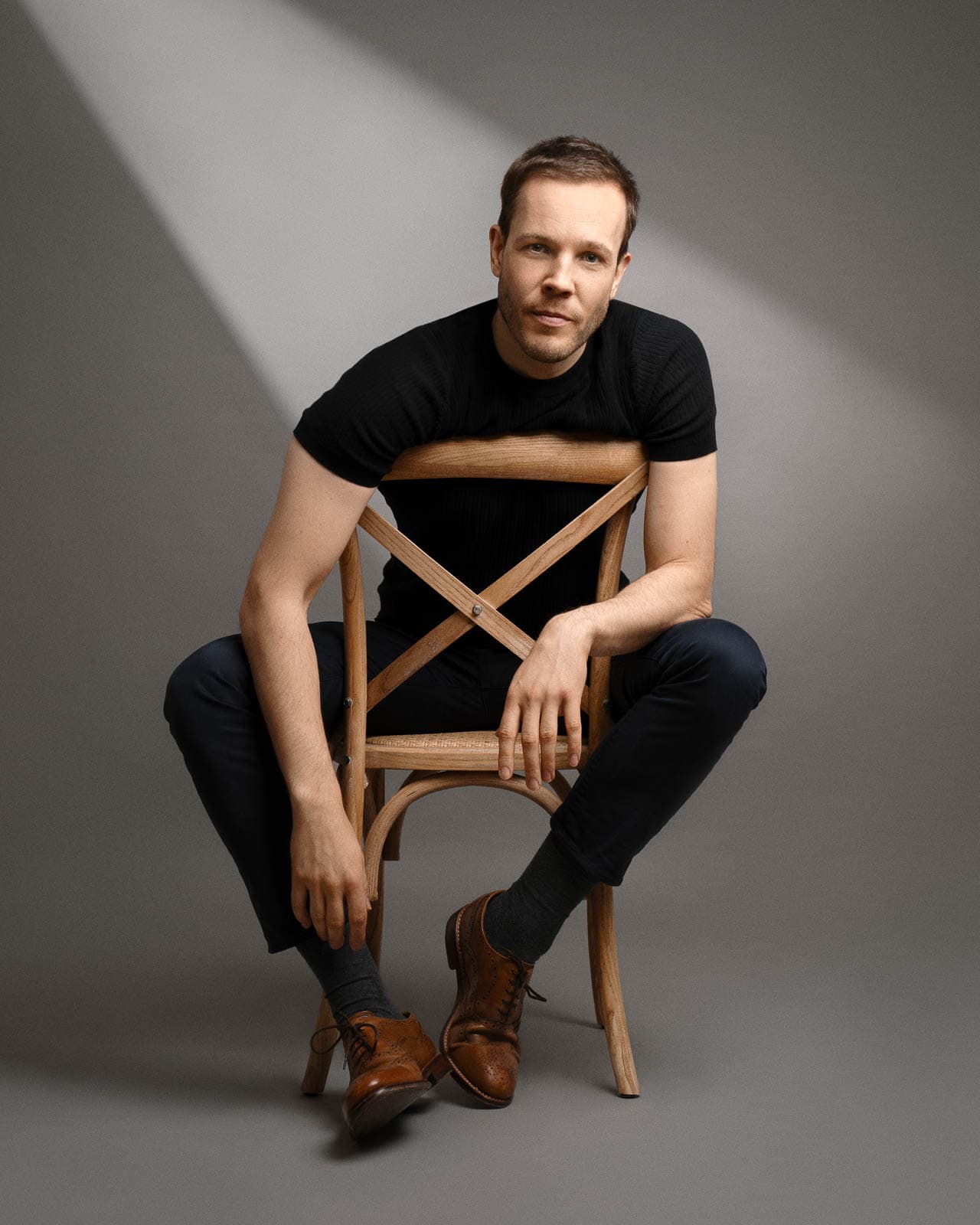 Artistic London portrait photography using dramatic studio lighting.