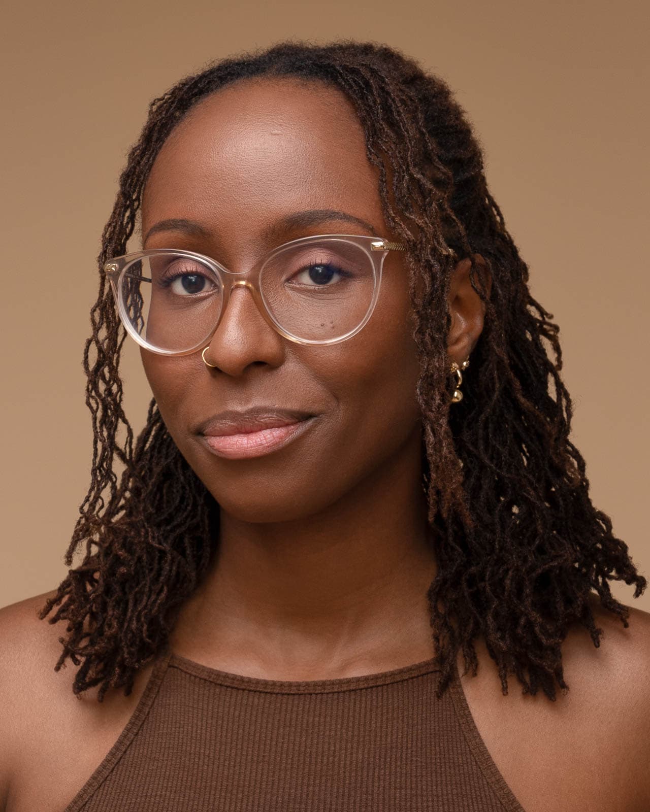 Professional portrait session in London studio with warm background.