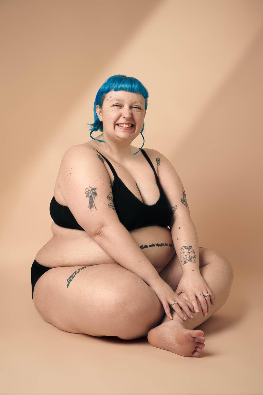 Boudoir portrait with black underwear in a private London studio.