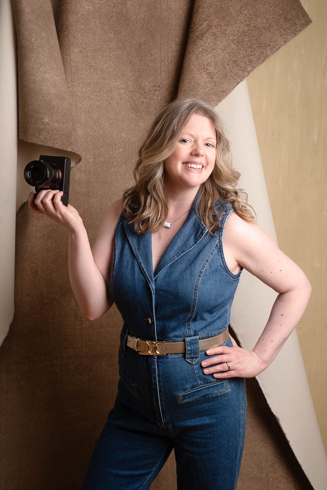 London headshot photographer Siorna Ashby in her studio holding a camera